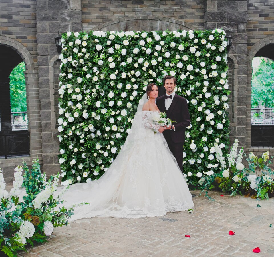 country wedding arch with hatns