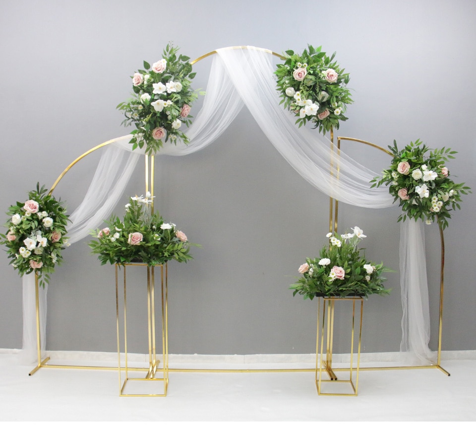 decorating an arch with tulle for a wedding