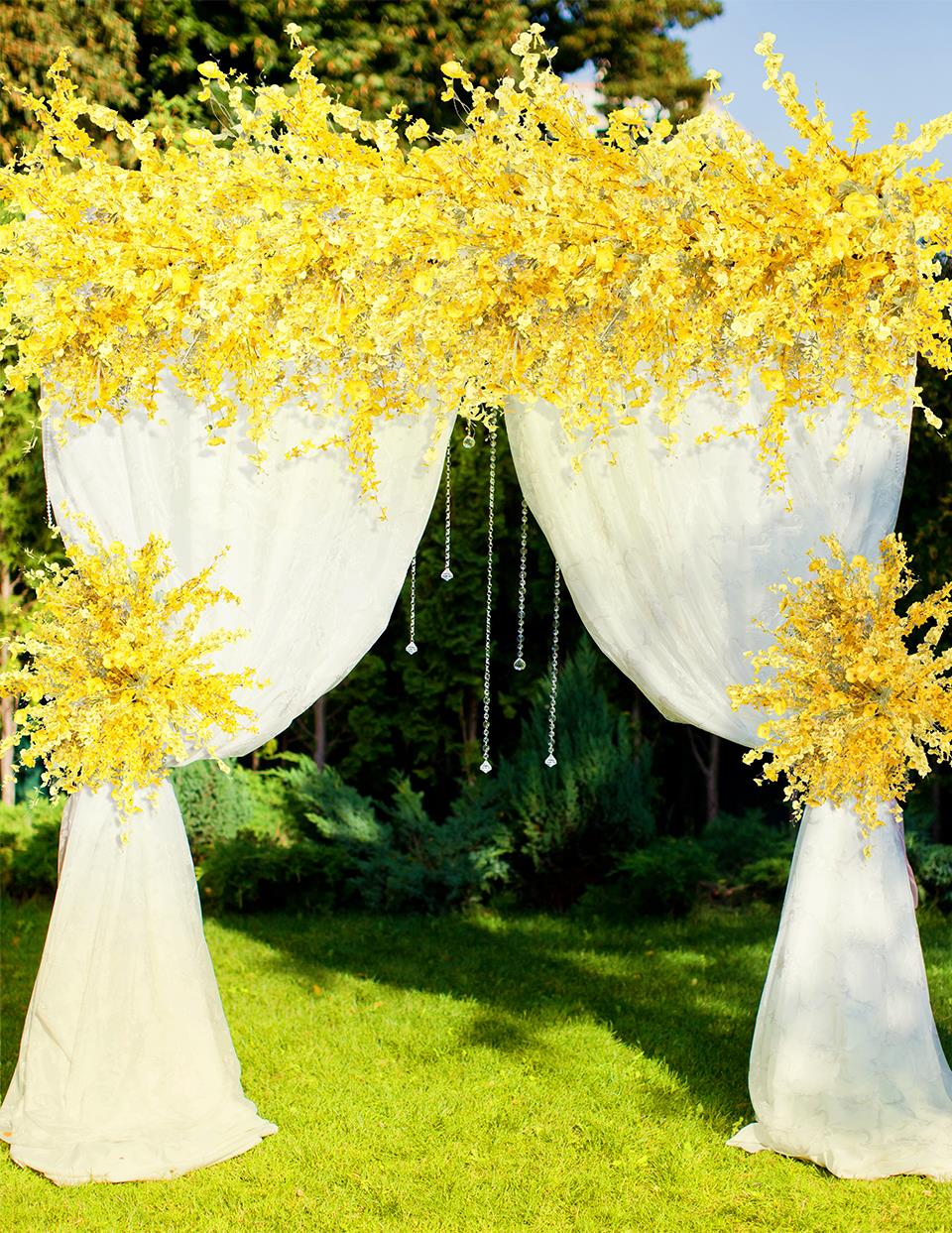 faux flower arrangements in milk jug