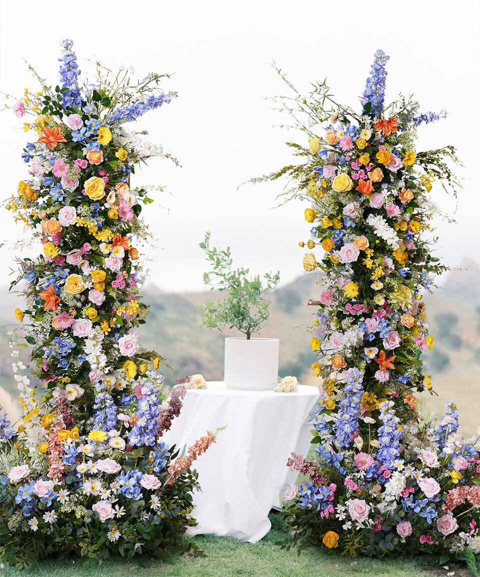 blue and purple flower arrangements arch