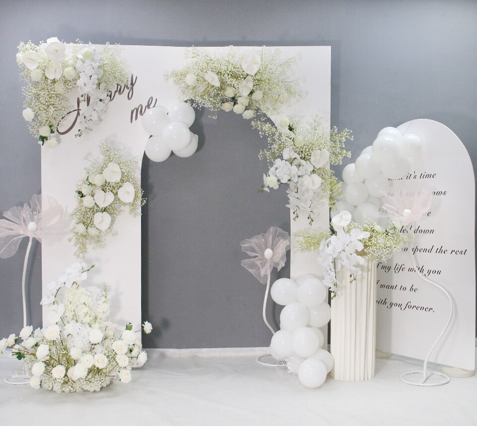 greenery wall with script letter flower